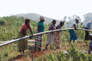 Community women install pipeline